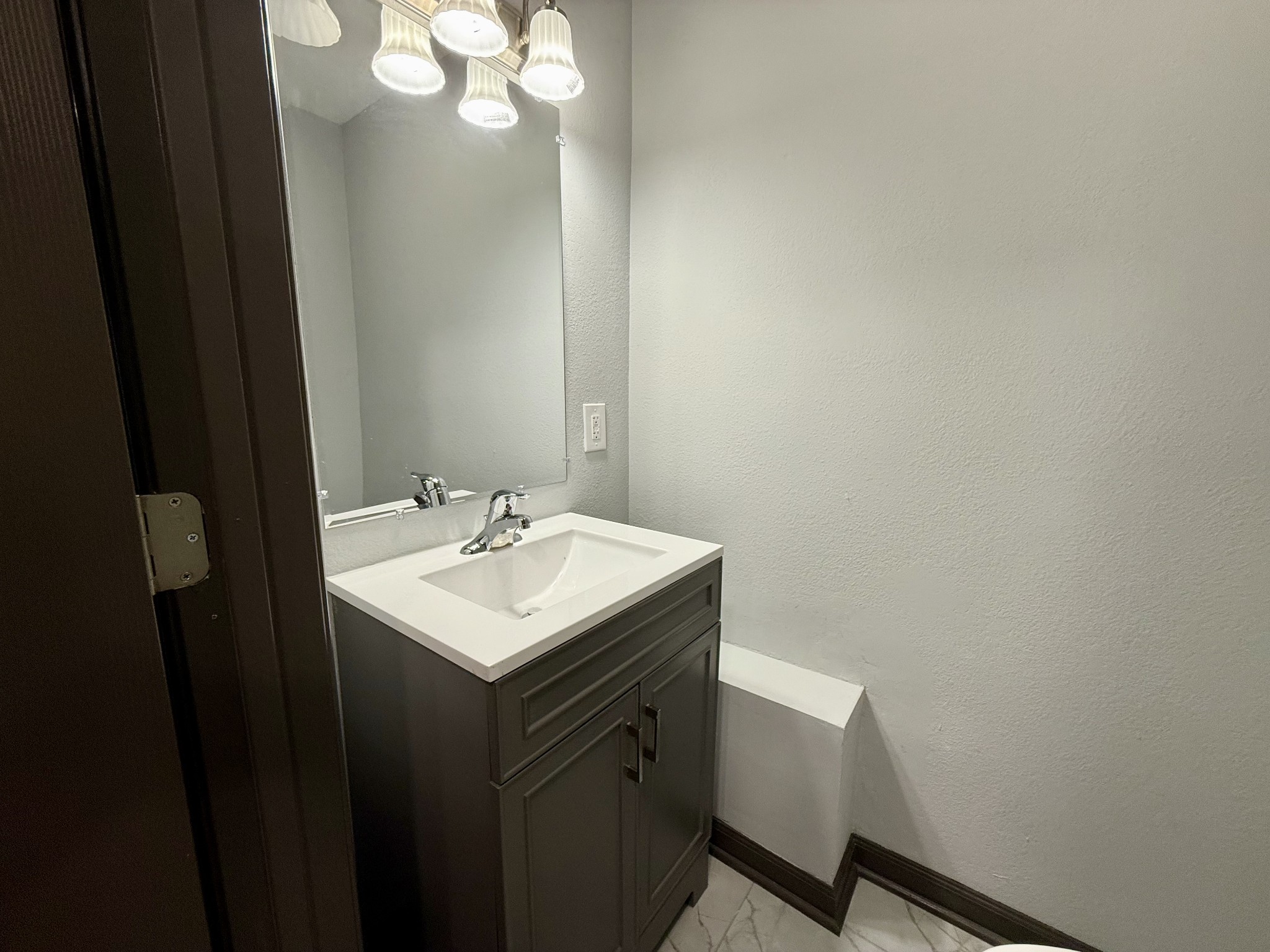 9388 Harrison Ferry Road McMinnville, TN 37110 - Photo 18 of 50 a bathroom with a sink vanity and a mirror