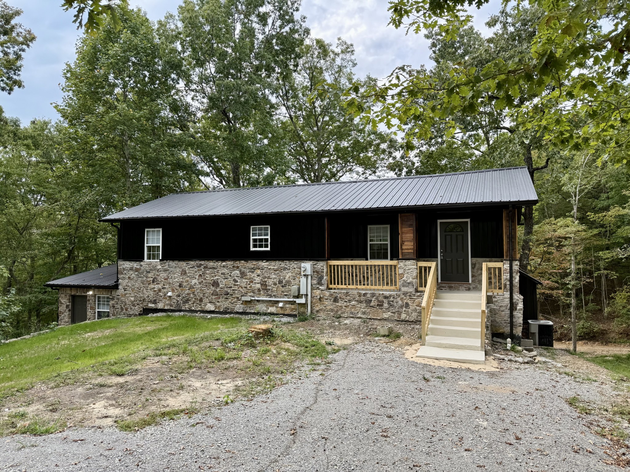 9388 Harrison Ferry Road McMinnville, TN 37110 - Photo 2 of 50 a front view of a house with a yard