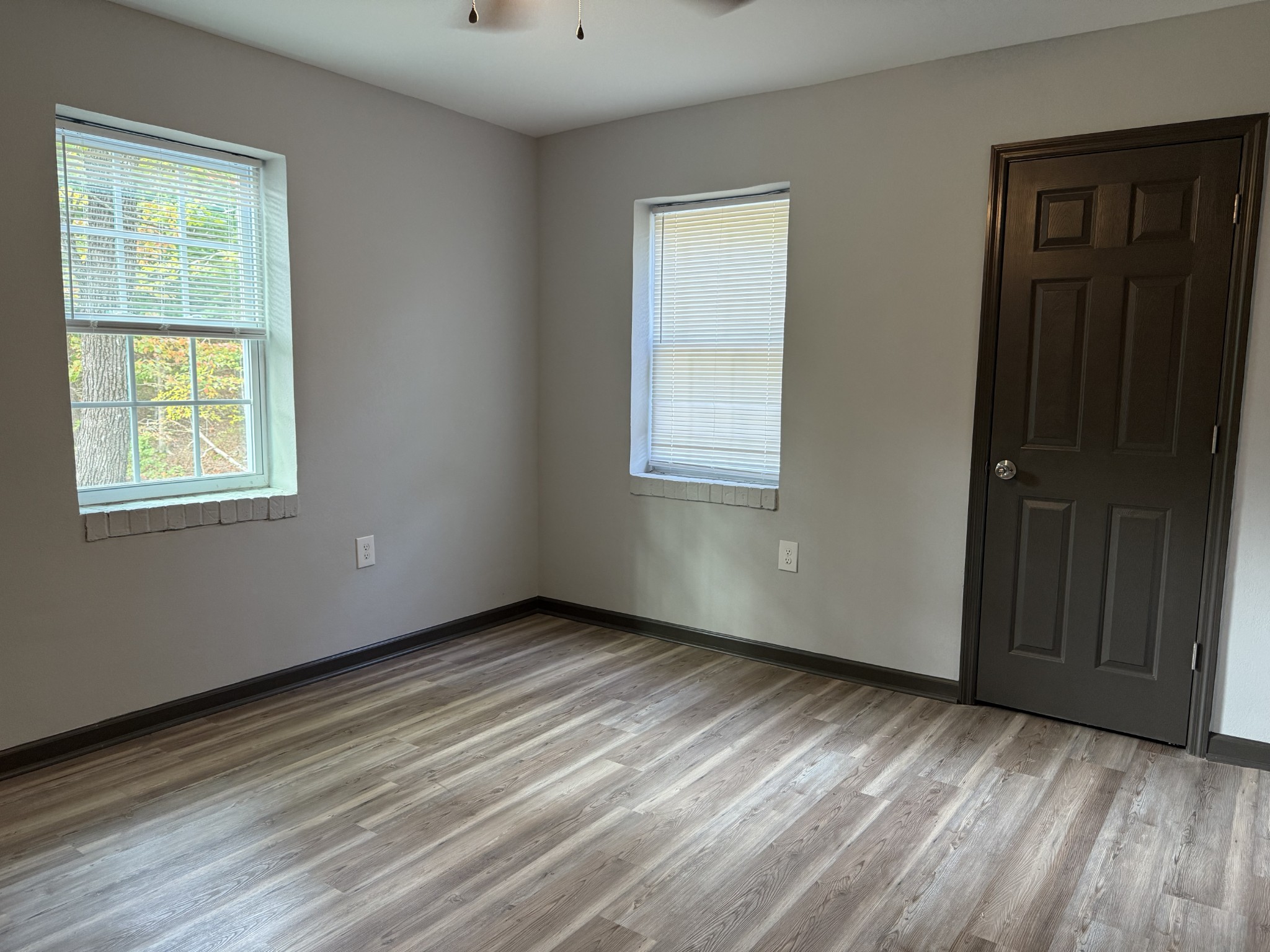 9388 Harrison Ferry Road McMinnville, TN 37110 - Photo 24 of 50 a view of an empty room with wooden floor and a window
