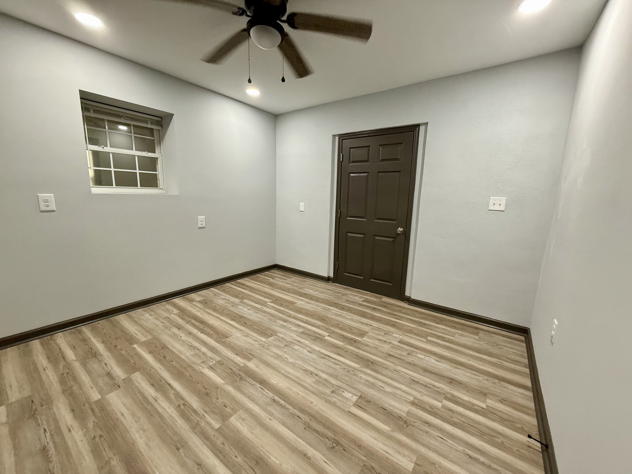 9388 Harrison Ferry Road McMinnville, TN 37110 - Photo 30 of 50 a view of empty room with wooden floor and fan