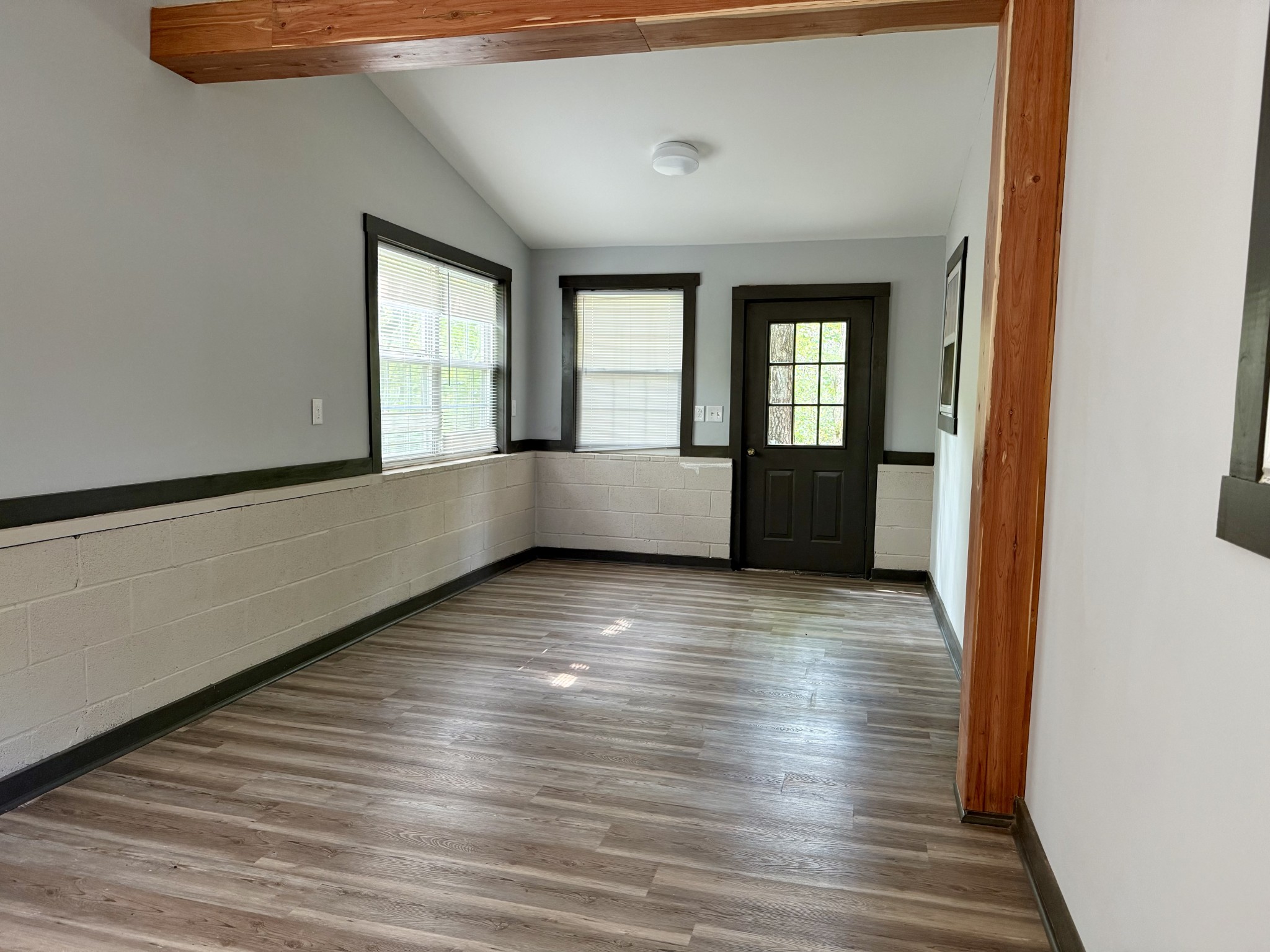 9388 Harrison Ferry Road McMinnville, TN 37110 - Photo 31 of 50 a view of an empty room with wooden floor and a window
