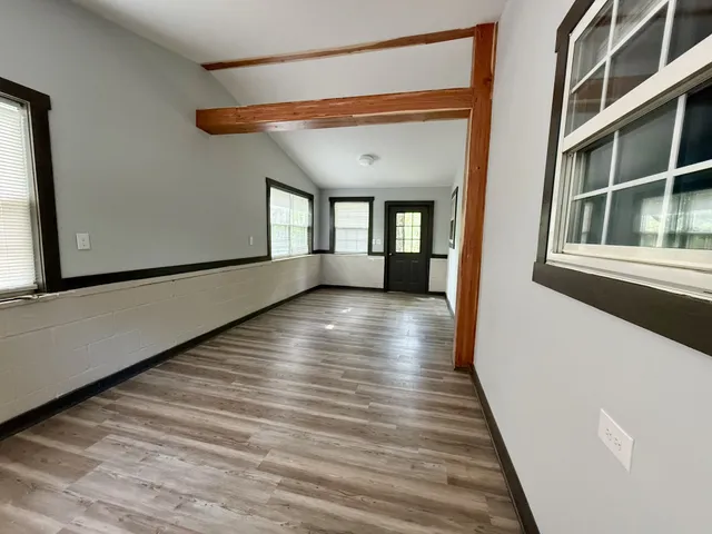 a view of gallery with wooden floor