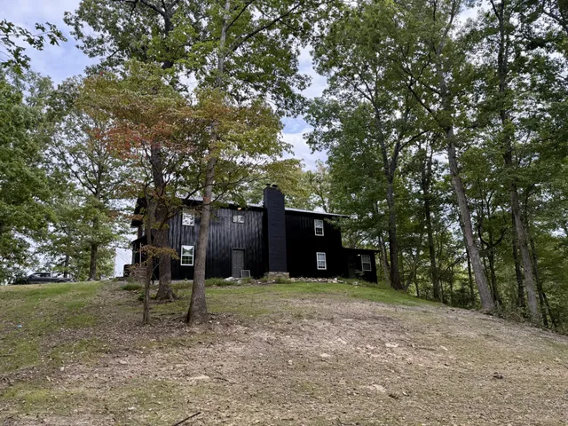 a view of a tree in front of a house