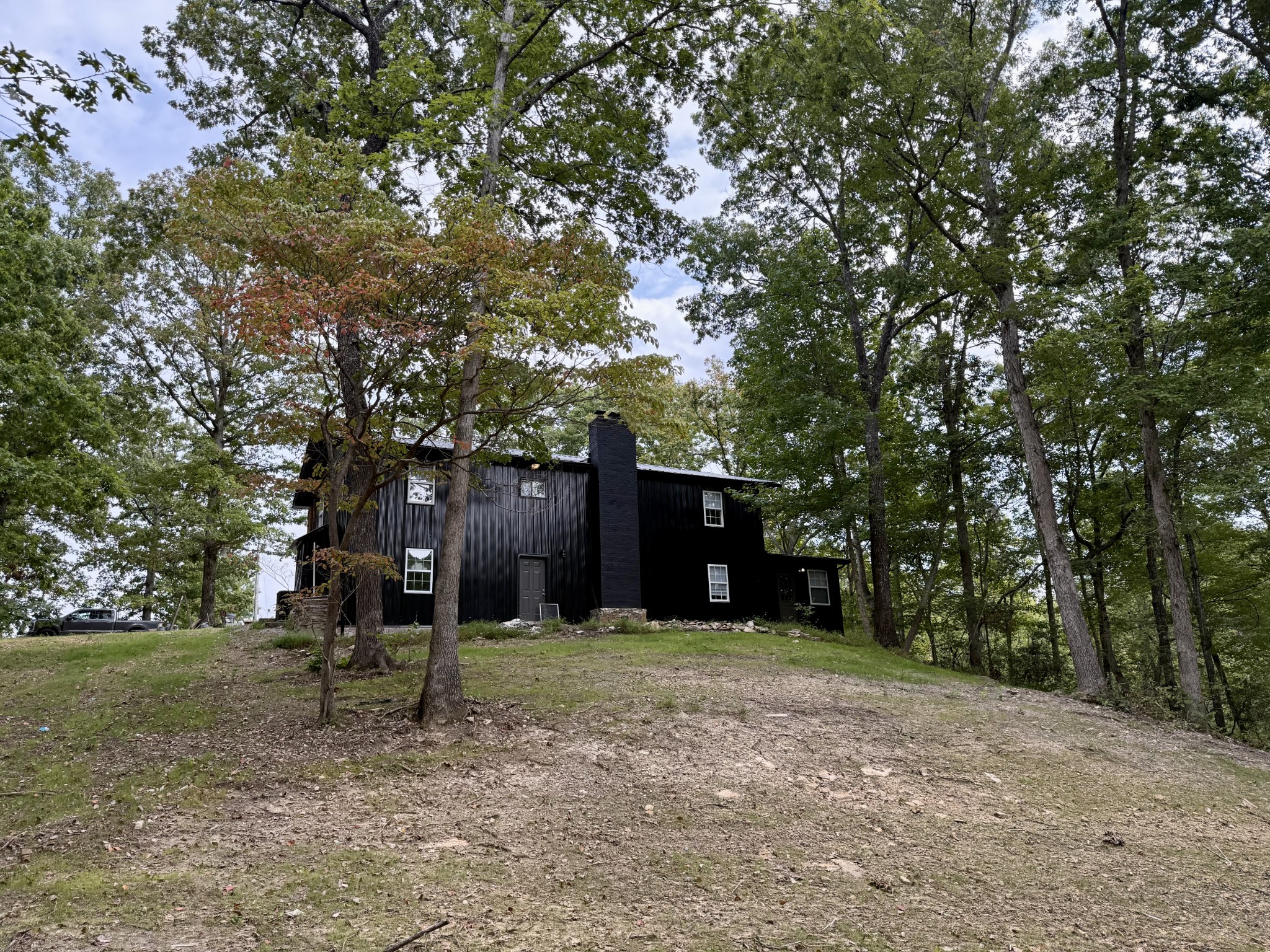 9388 Harrison Ferry Road McMinnville, TN 37110 - Photo 42 of 50 a view of a tree in front of a house