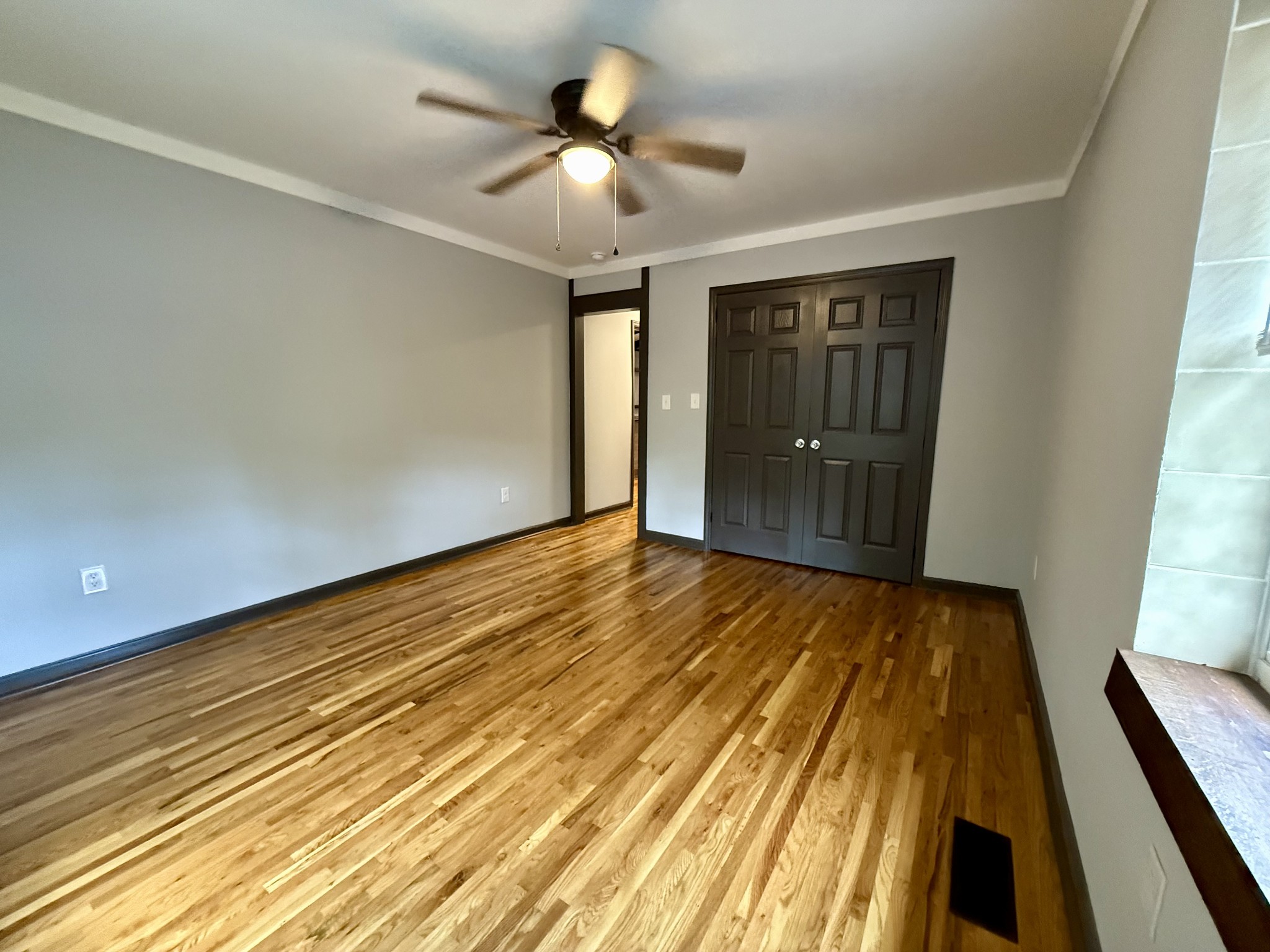 9388 Harrison Ferry Road McMinnville, TN 37110 - Photo 10 of 50 a view of an empty room with wooden floor and a window