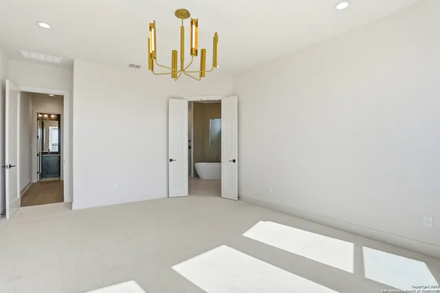 a view of a hallway with a bathroom