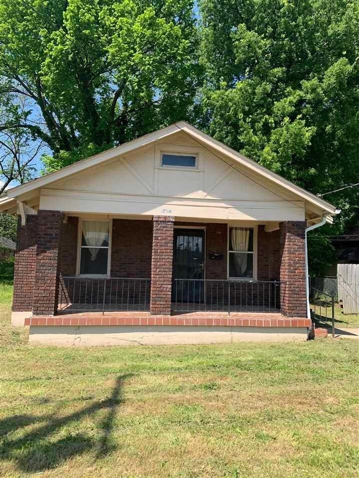 1483 Swift Street Memphis, TN 38109 - Photo 1 of 1 a view of a house with a backyard