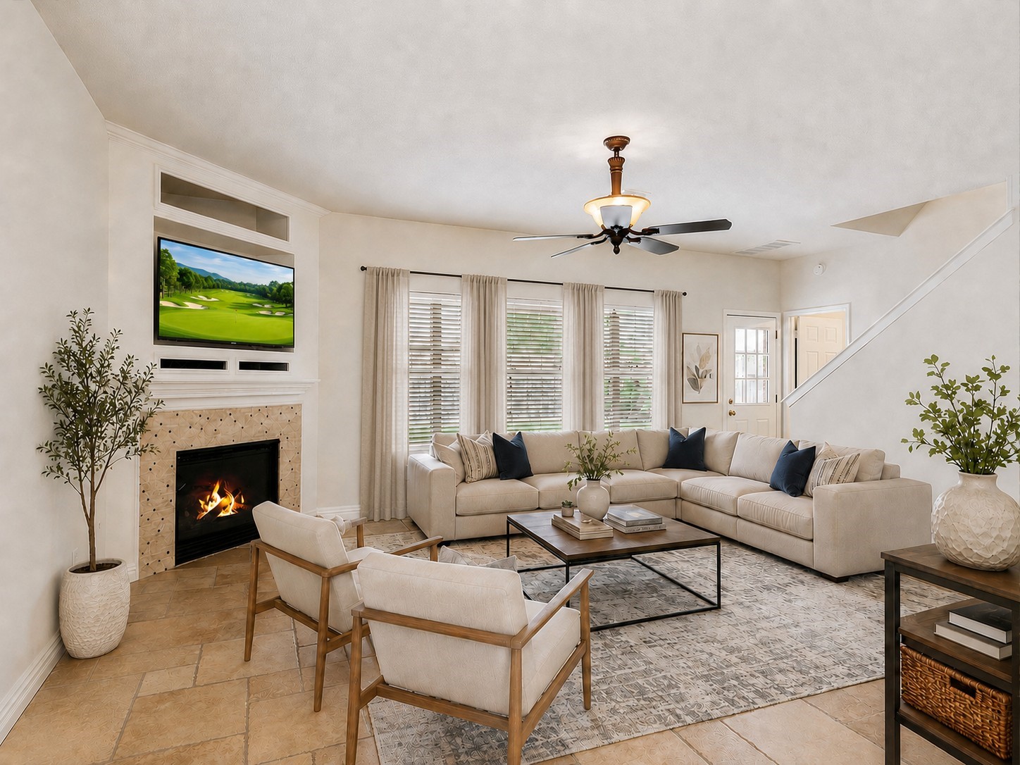 19422 Harvest Stream Way Houston, TX 77084 - Photo 4 of 41 Experience the perfect blend of warmth and elegance in this spacious living room, featuring a cozy fireplace and soaring ceilings. AI-staged design to help you envision your dream space.