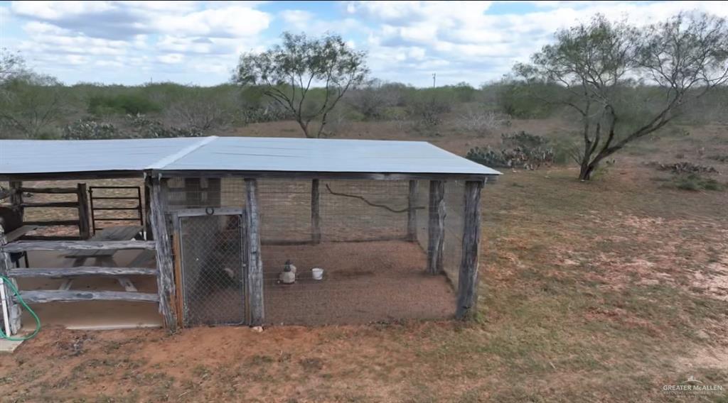 69 Energy Road San Isidro, TX 78588 - Photo 7 of 12 View of outdoor structure featuring a rural view