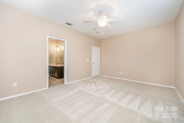 a view of an empty room with a bathroom