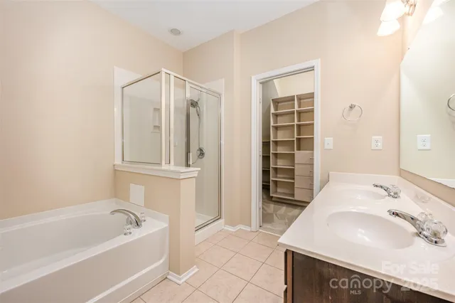 a bathroom with a sink a mirror and a bathtub