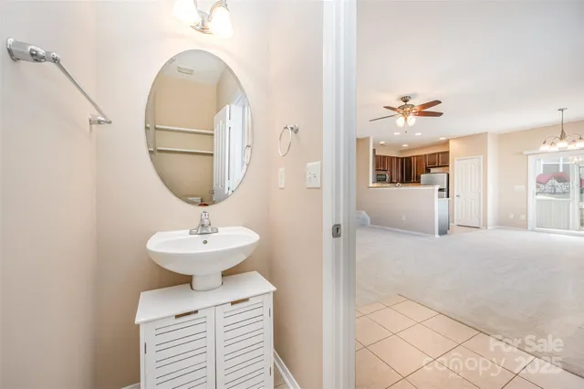 a view of living room with a sink and chandelier