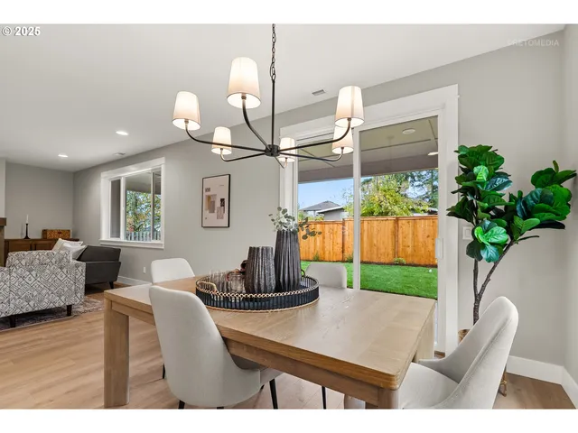 a living room with furniture potted plant and a lamp