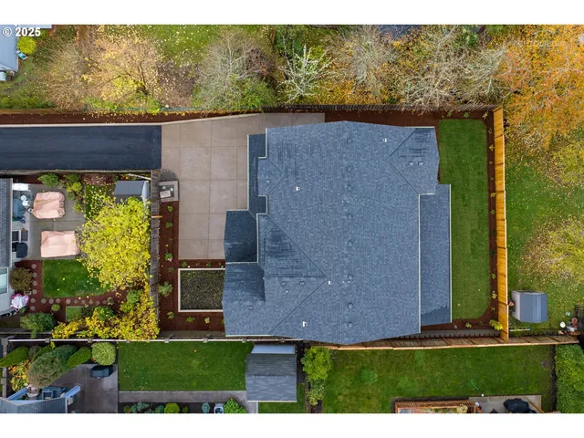 an aerial view of a house with a swimming pool