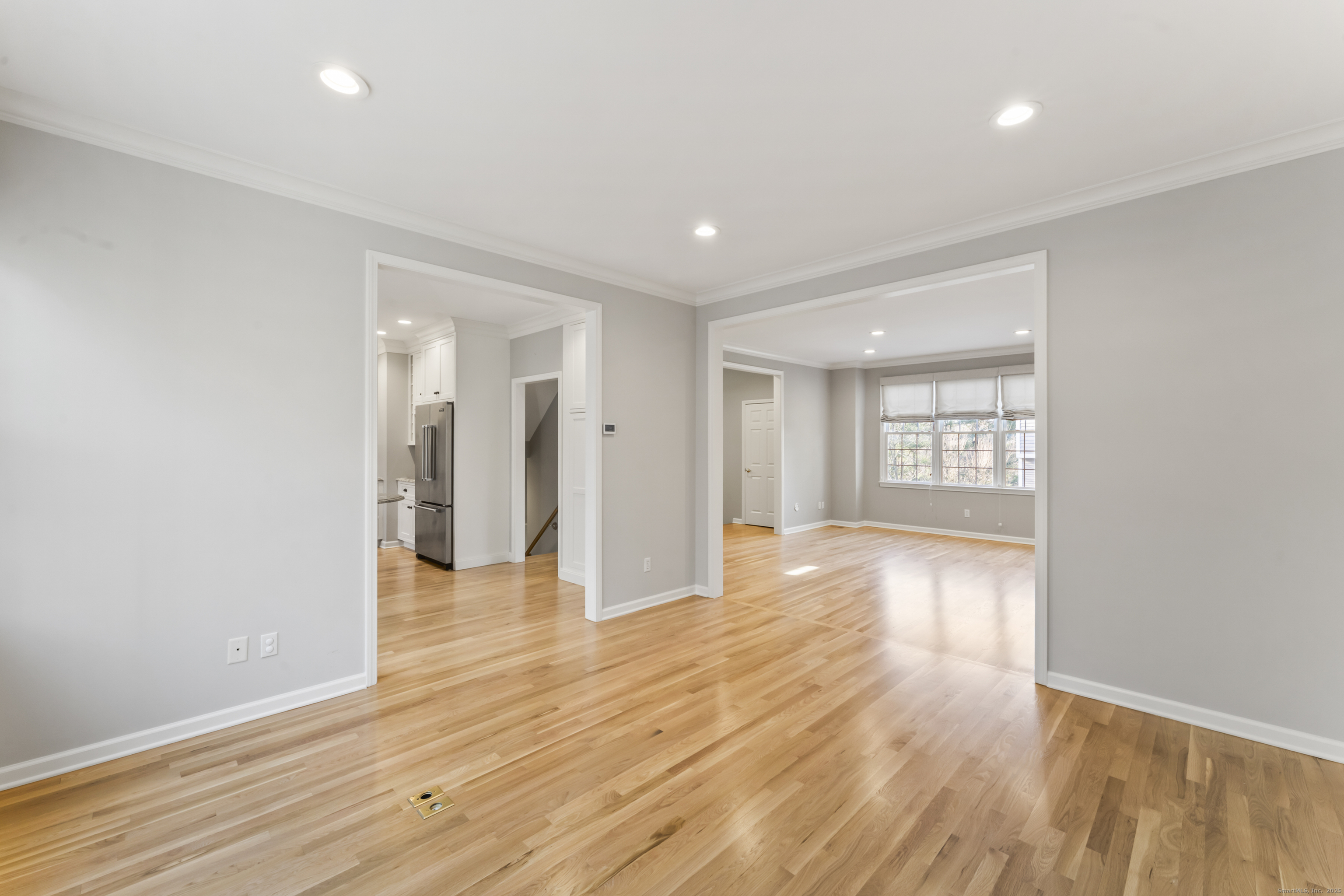4 Woods Way New Fairfield, CT 06812 - Photo 12 of 39 a view of an empty room with wooden floor and a window
