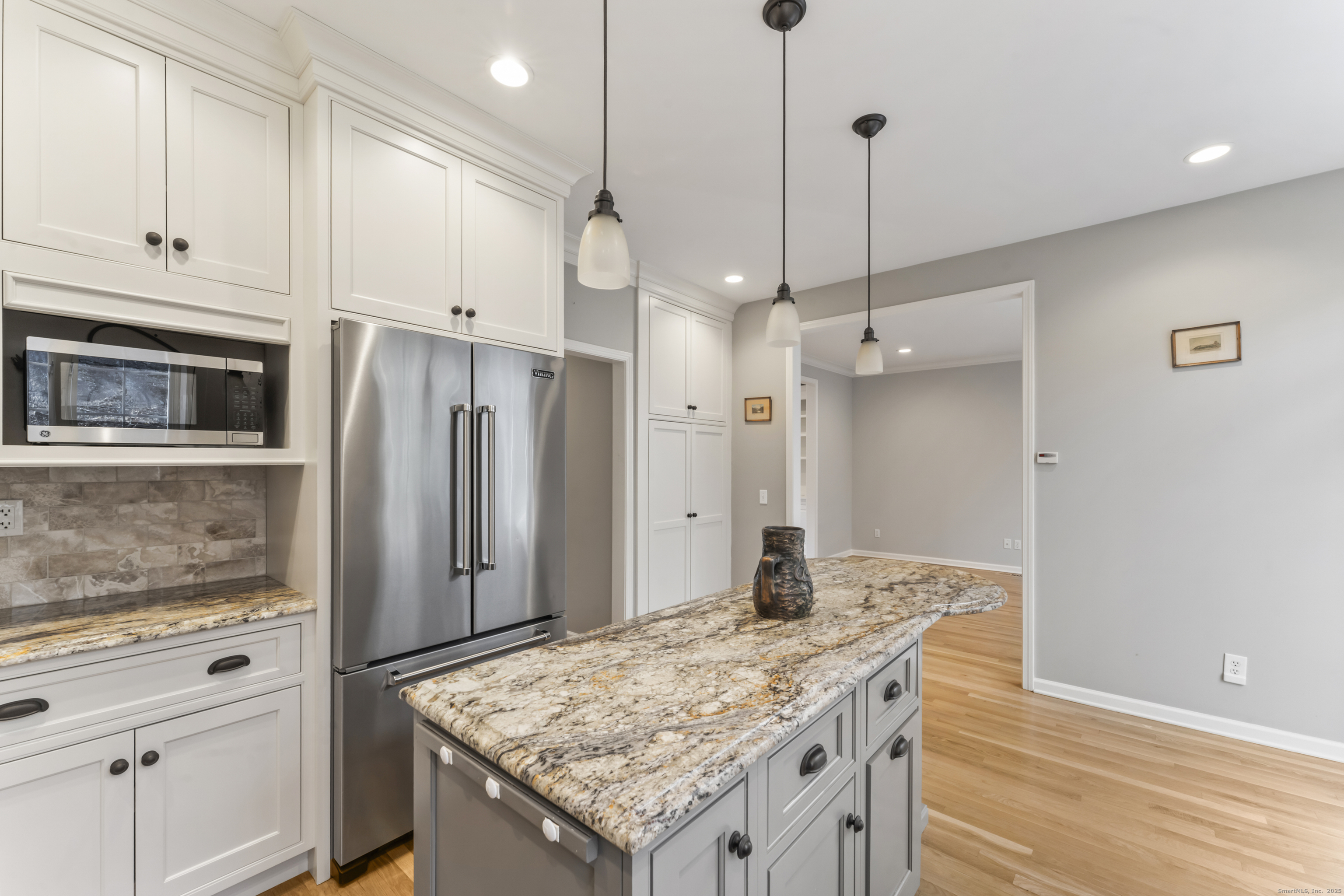 4 Woods Way New Fairfield, CT 06812 - Photo 15 of 39 a kitchen with stainless steel appliances granite countertop wooden cabinets a refrigerator and a stove