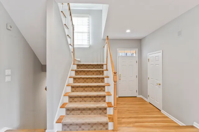 a view of an entryway with wooden floor