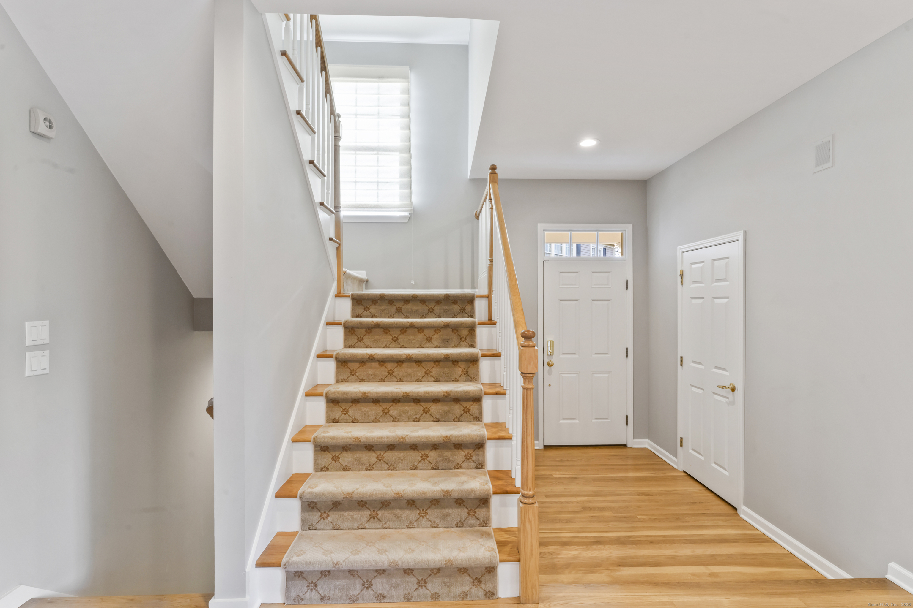 4 Woods Way New Fairfield, CT 06812 - Photo 17 of 39 a view of an entryway with wooden floor