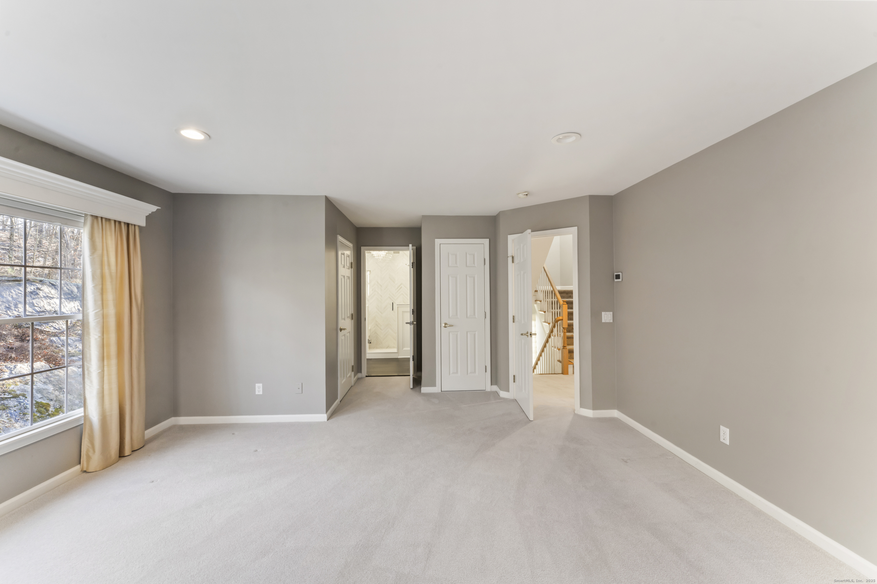 4 Woods Way New Fairfield, CT 06812 - Photo 21 of 39 an empty room with windows and closet