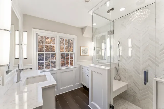 a bathroom with a tub sink toilet and a shower