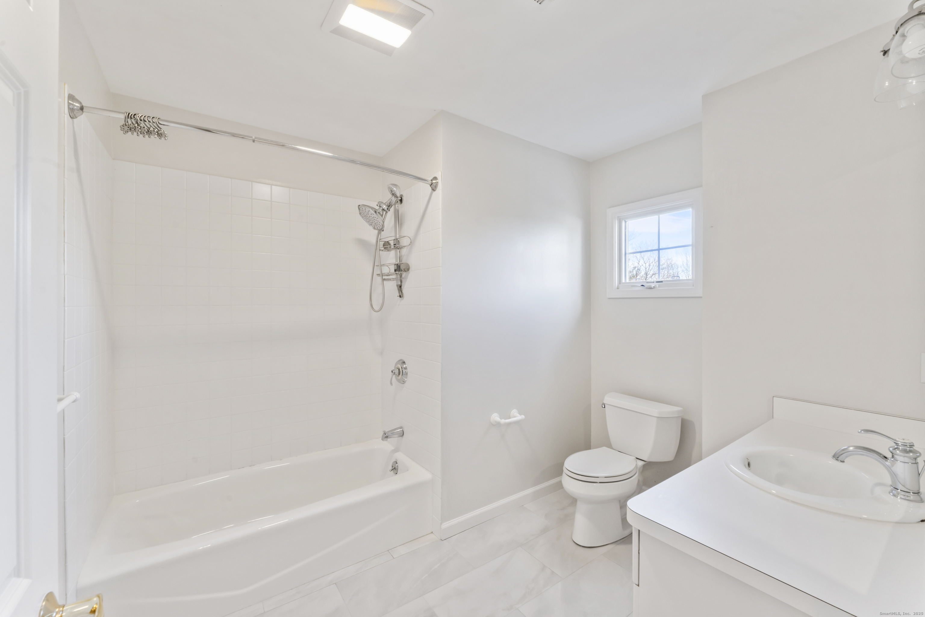 4 Woods Way New Fairfield, CT 06812 - Photo 26 of 39 a bathroom with a bathtub shower sink vanity and toilet