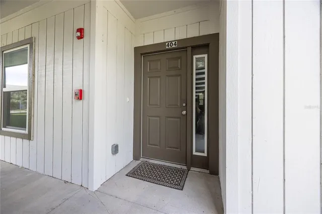 a bathroom with a shower and a sink