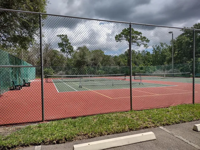 a view of a yard with a table and chair
