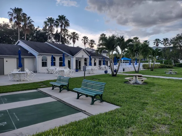 a view of a house with a yard porch and sitting area