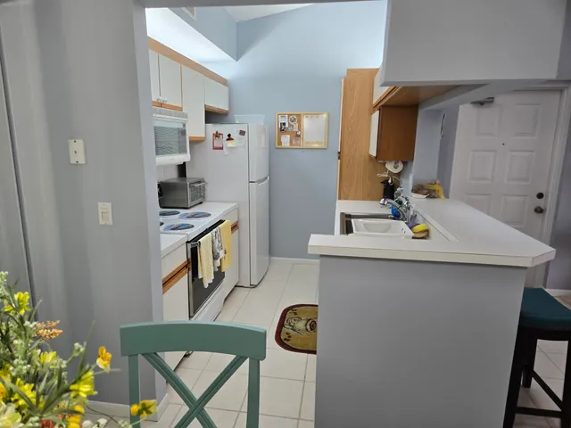 a bathroom with a sink a mirror and shower