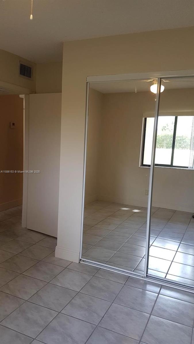 11386 Royal Palm Boulevard, Unit 11386 Coral Springs, FL 33065 - Photo 6 of 10 a view of empty room