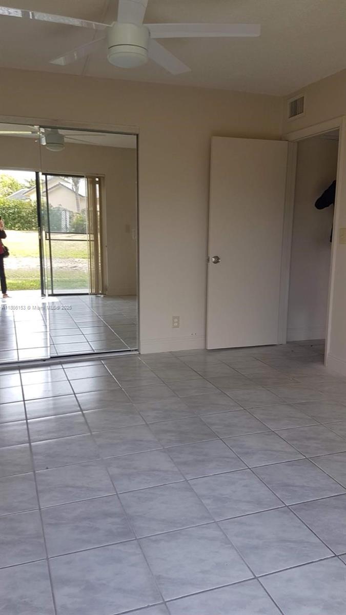 11386 Royal Palm Boulevard, Unit 11386 Coral Springs, FL 33065 - Photo 7 of 10 a view of an empty room and a window