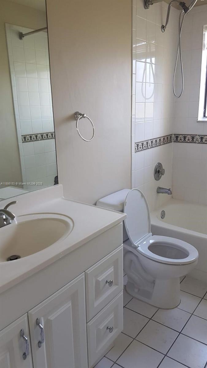 11386 Royal Palm Boulevard, Unit 11386 Coral Springs, FL 33065 - Photo 8 of 10 a bathroom with a toilet and a sink