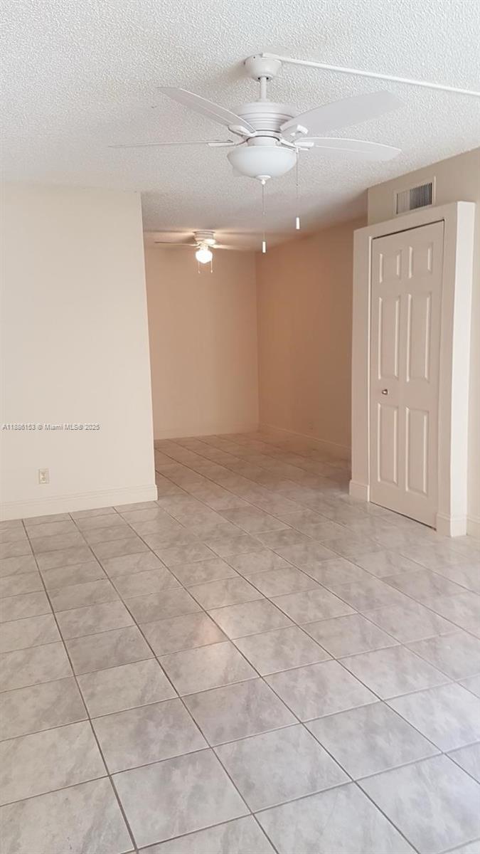 11386 Royal Palm Boulevard, Unit 11386 Coral Springs, FL 33065 - Photo 9 of 10 a view of an empty room with a window