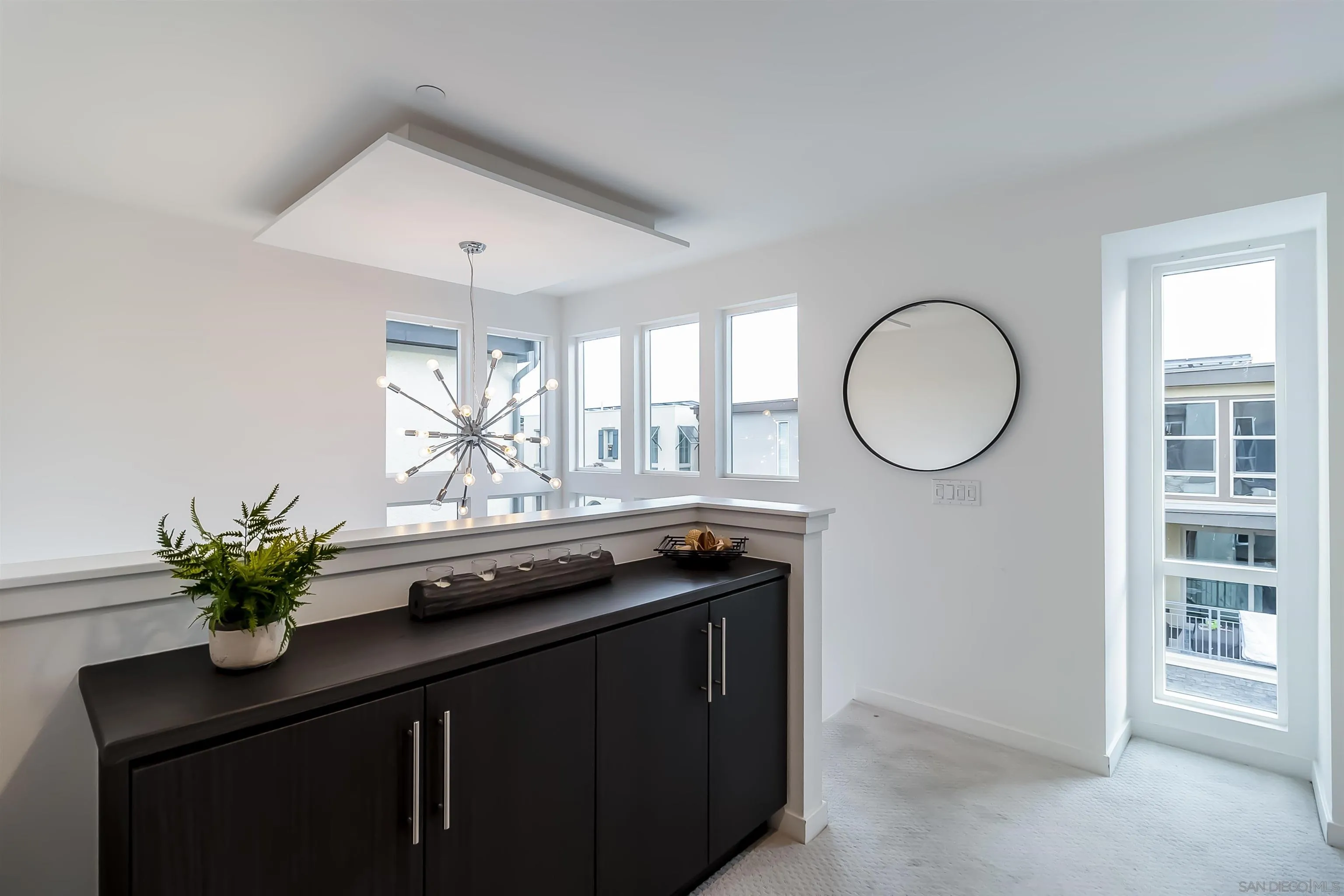 8344 Summit Way San Diego, CA 92108 - Photo 13 of 41 a bathroom with a granite countertop sink a mirror and a window