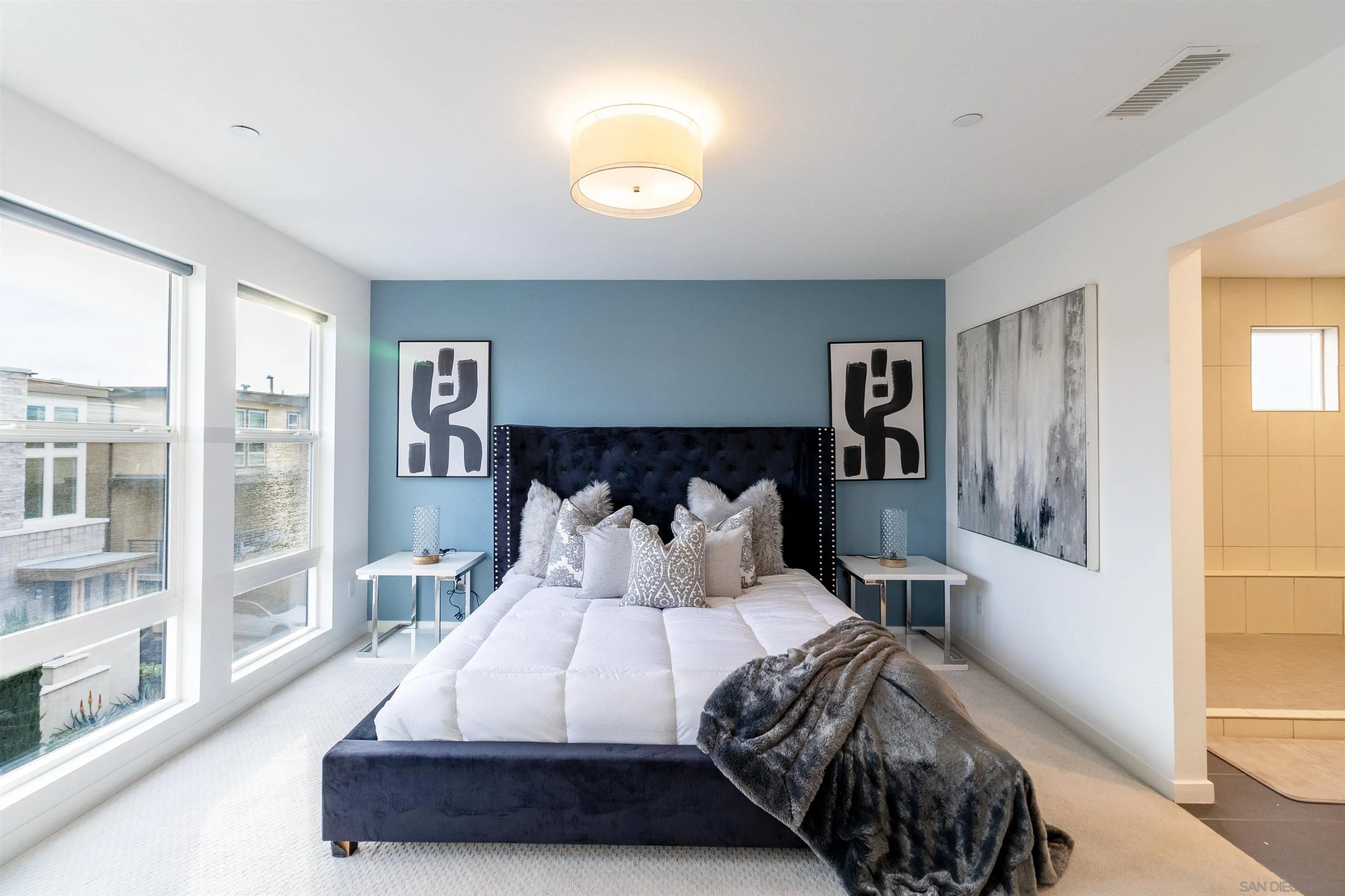 8344 Summit Way San Diego, CA 92108 - Photo 14 of 41 a bedroom with a large bed and a night stand