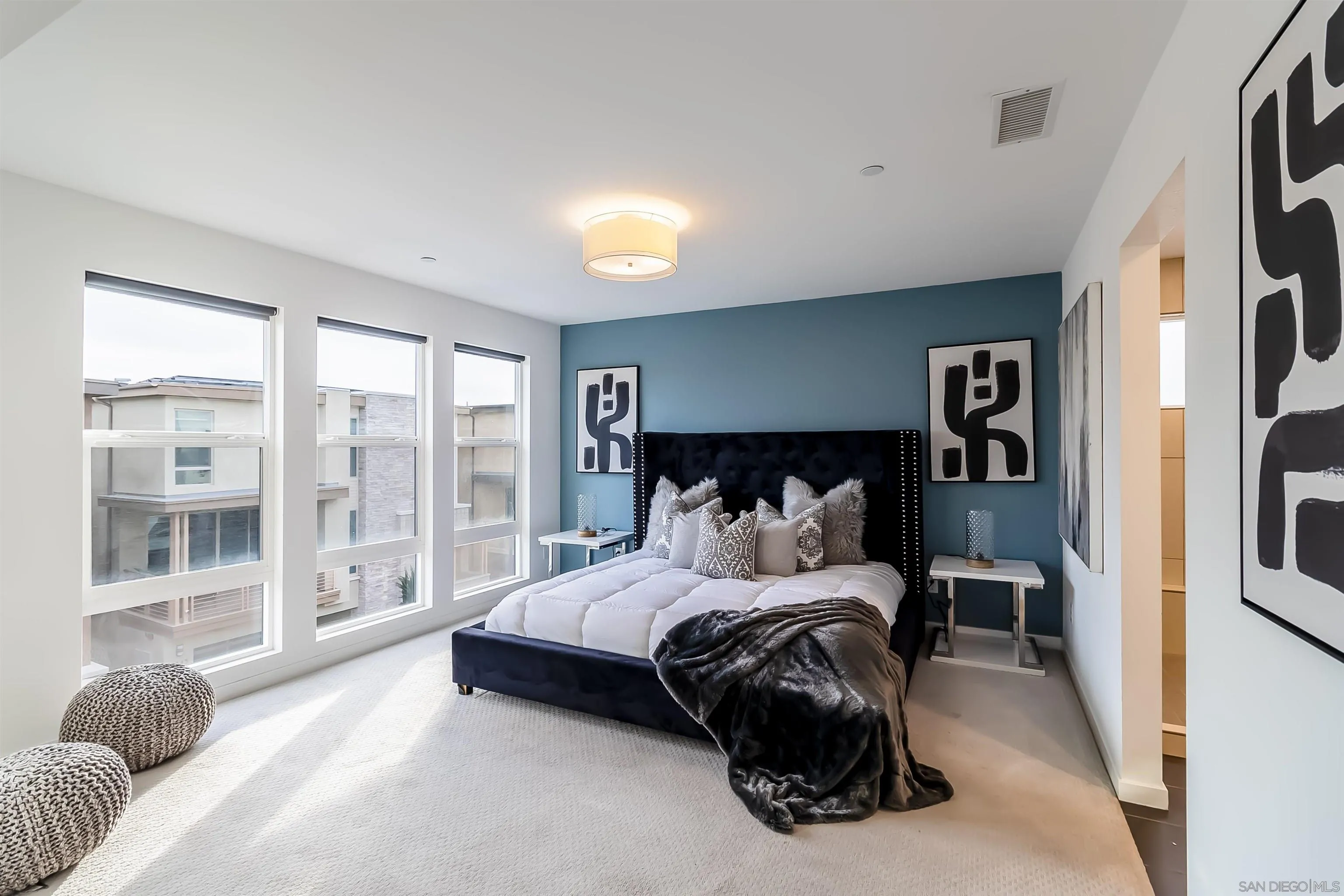 8344 Summit Way San Diego, CA 92108 - Photo 15 of 41 a bedroom with a bed and glass walk in closet