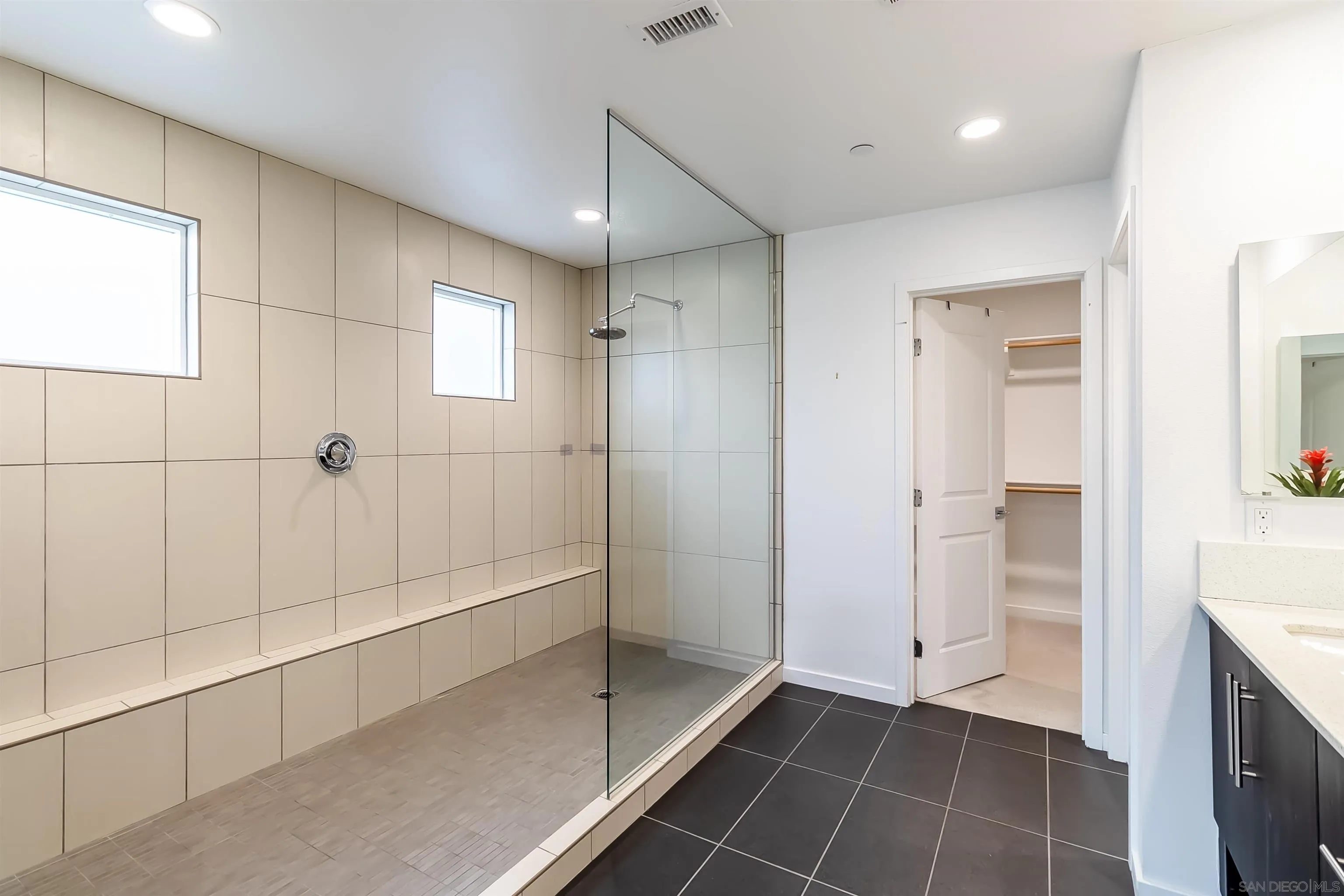 8344 Summit Way San Diego, CA 92108 - Photo 17 of 41 a bathroom with a bathtub and a shower