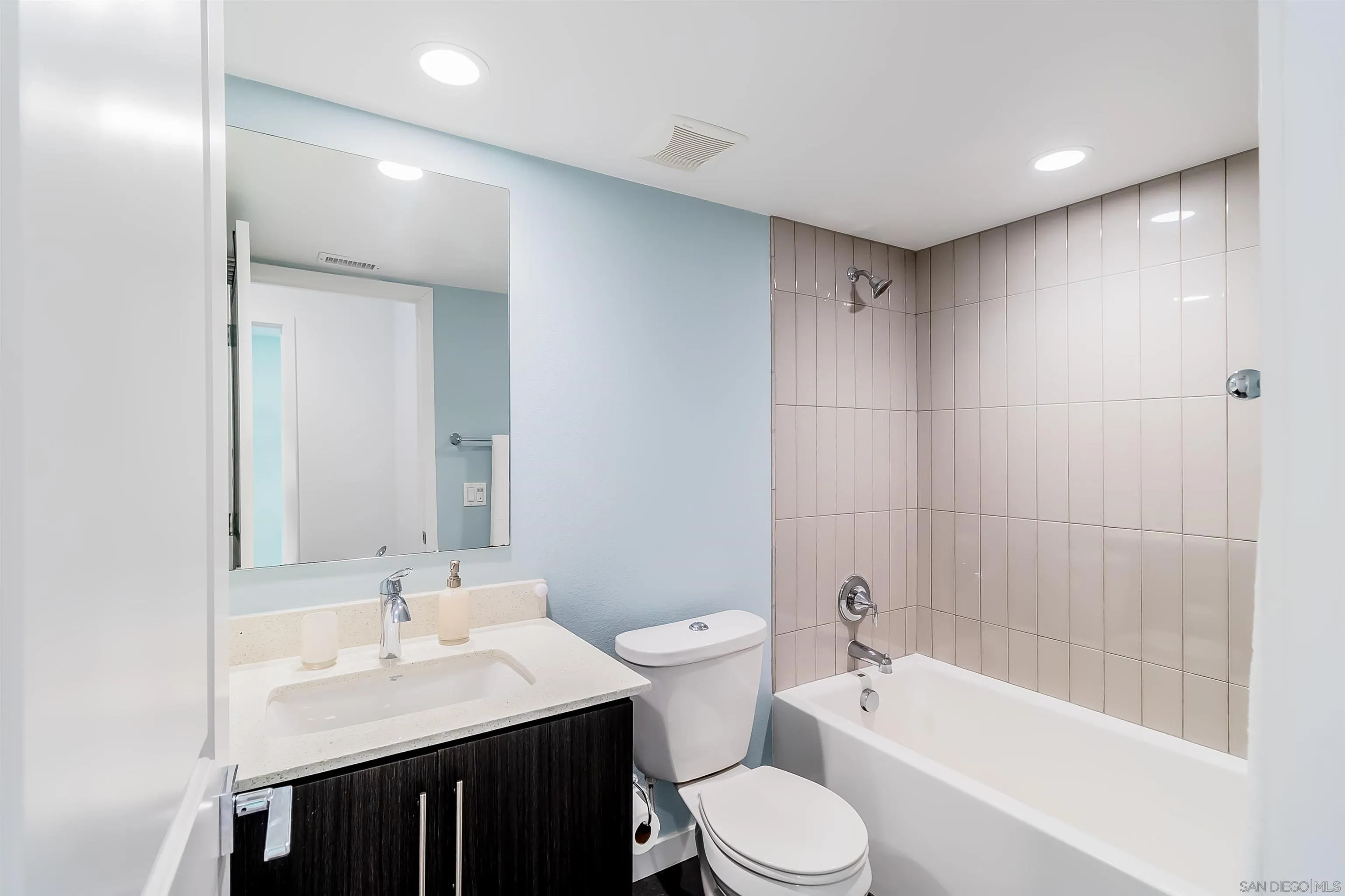 8344 Summit Way San Diego, CA 92108 - Photo 19 of 41 a bathroom with a bathtub shower sink mirror vanity and toilet