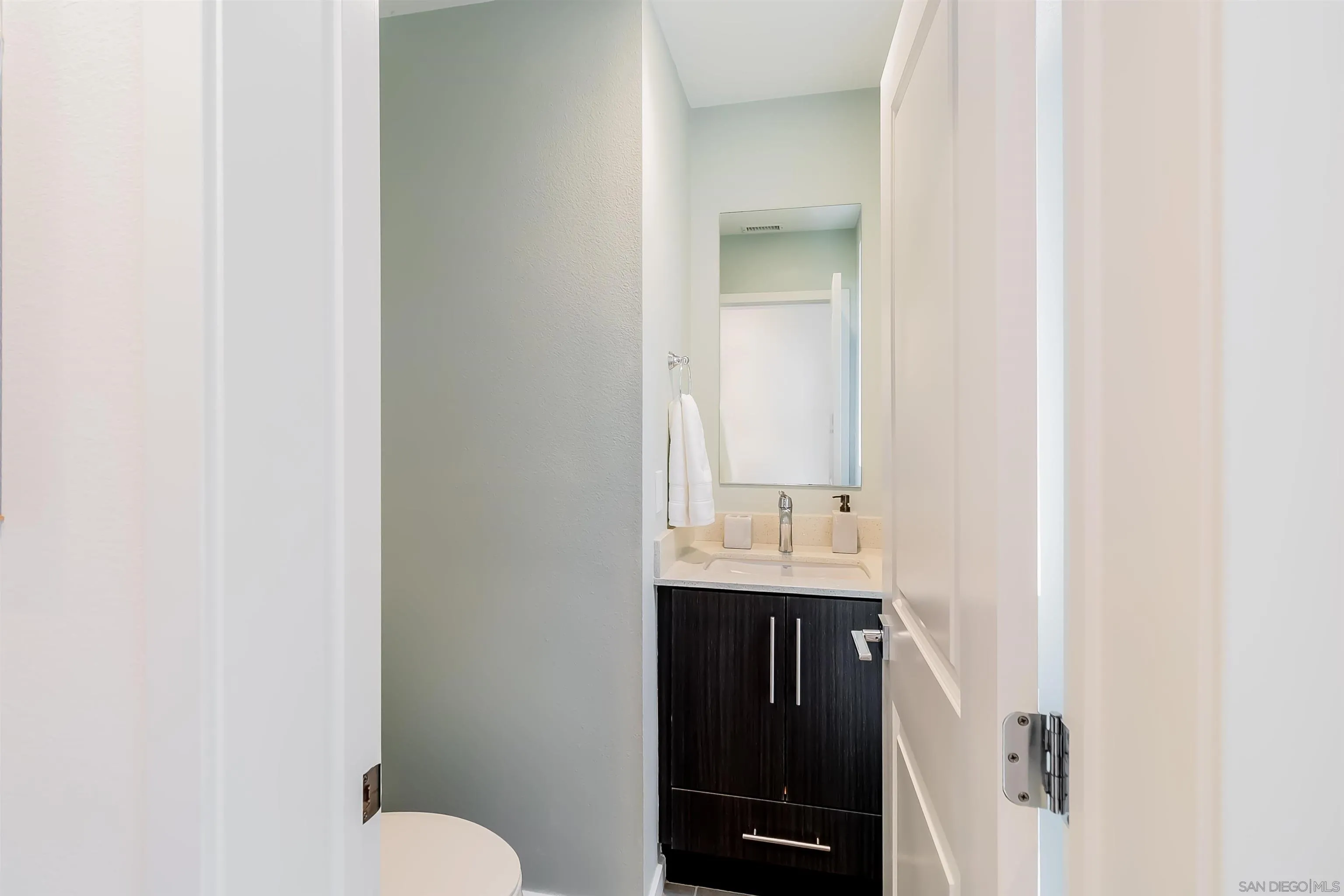 8344 Summit Way San Diego, CA 92108 - Photo 21 of 41 a bathroom with a sink and a toilet