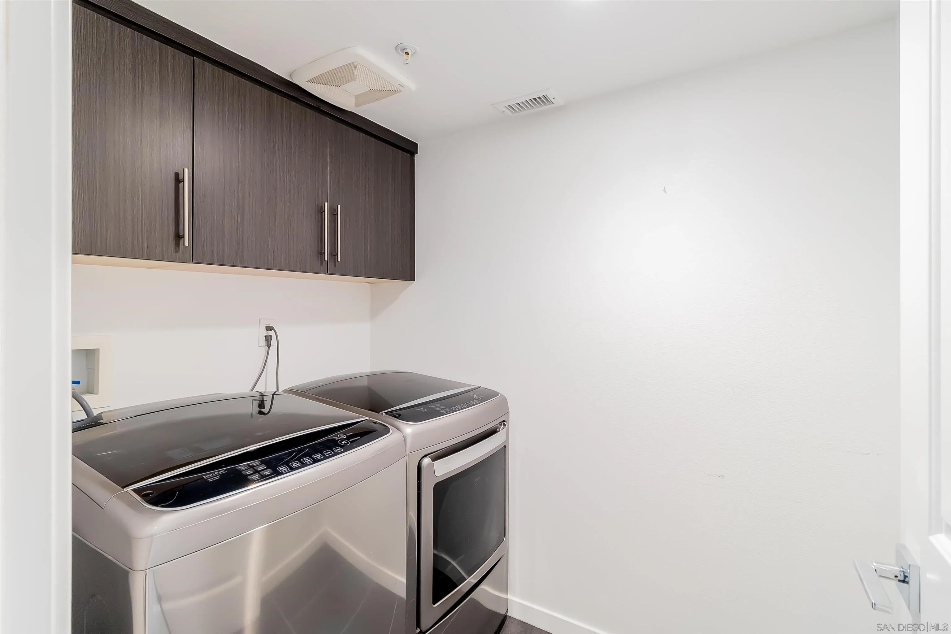 8344 Summit Way San Diego, CA 92108 - Photo 25 of 41 a kitchen with a sink and cabinets