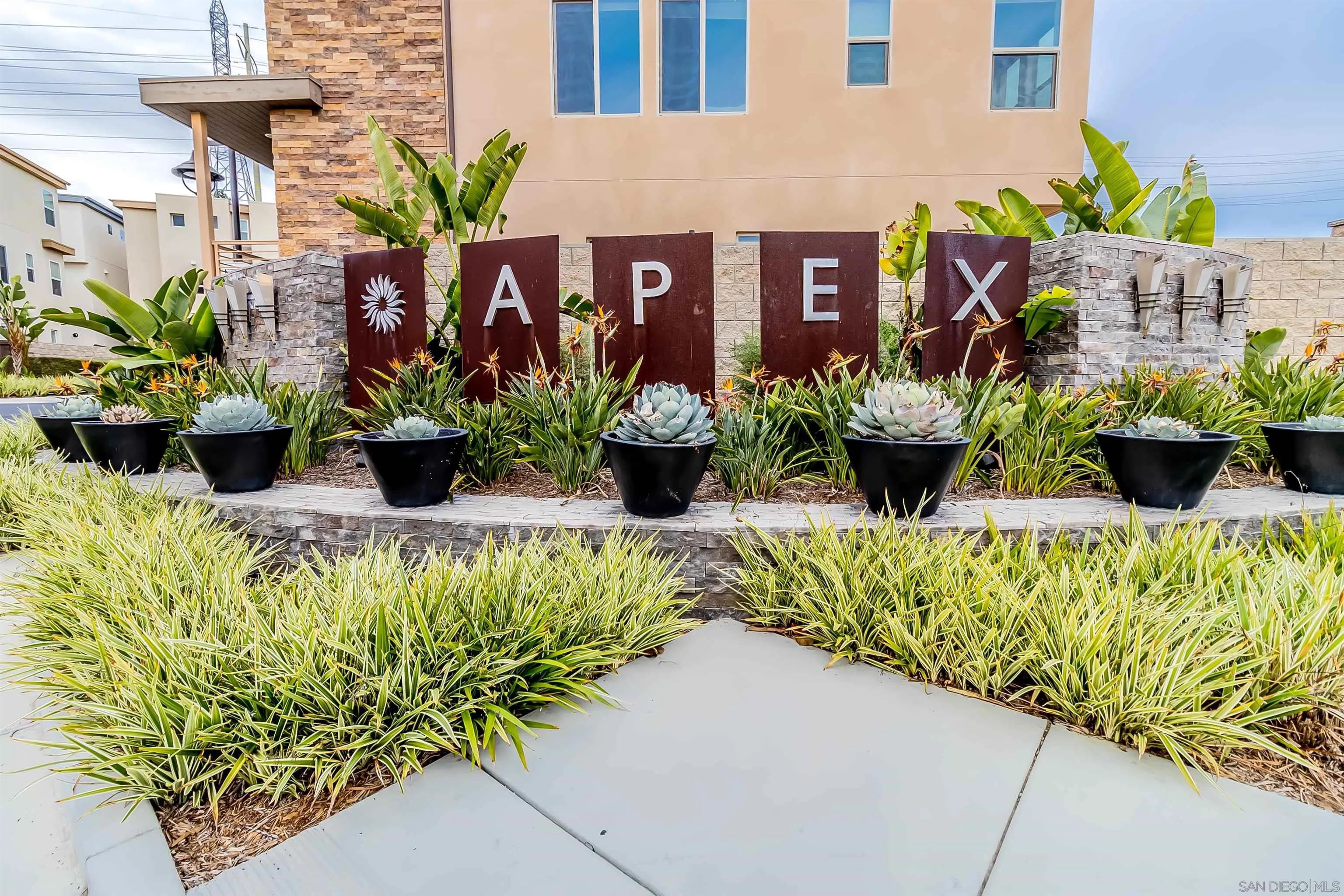 8344 Summit Way San Diego, CA 92108 - Photo 29 of 41 a front view of a house with blue flowers