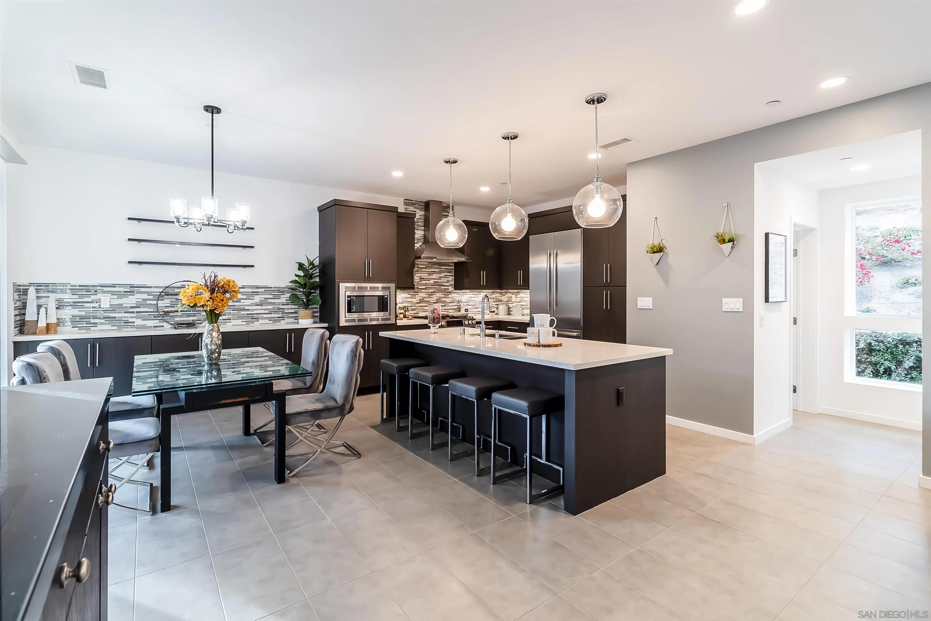 8344 Summit Way San Diego, CA 92108 - Photo 6 of 41 a living room with furniture a chandelier and a dining table