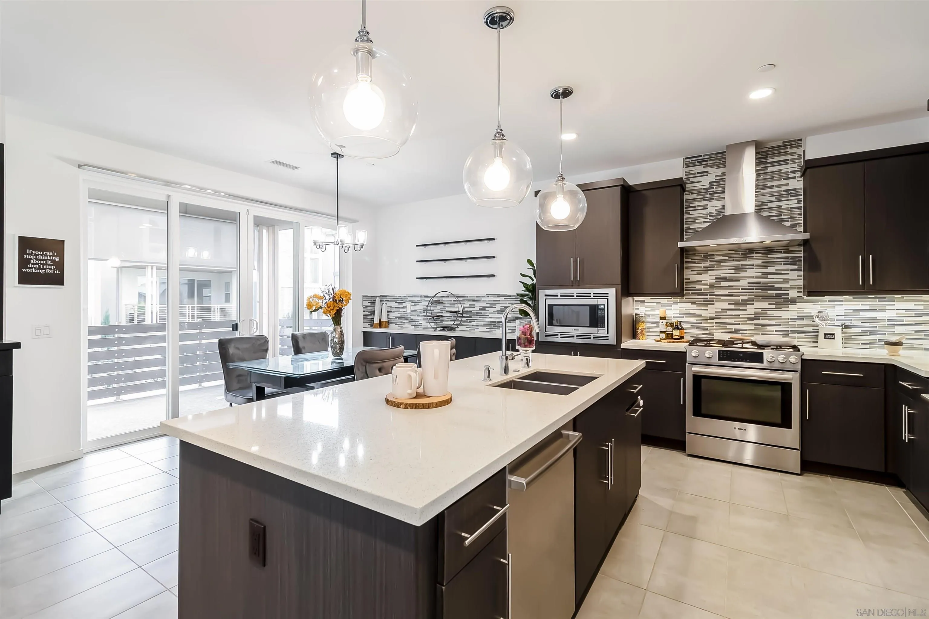 8344 Summit Way San Diego, CA 92108 - Photo 7 of 41 a kitchen with a stove a sink a microwave and wooden cabinets