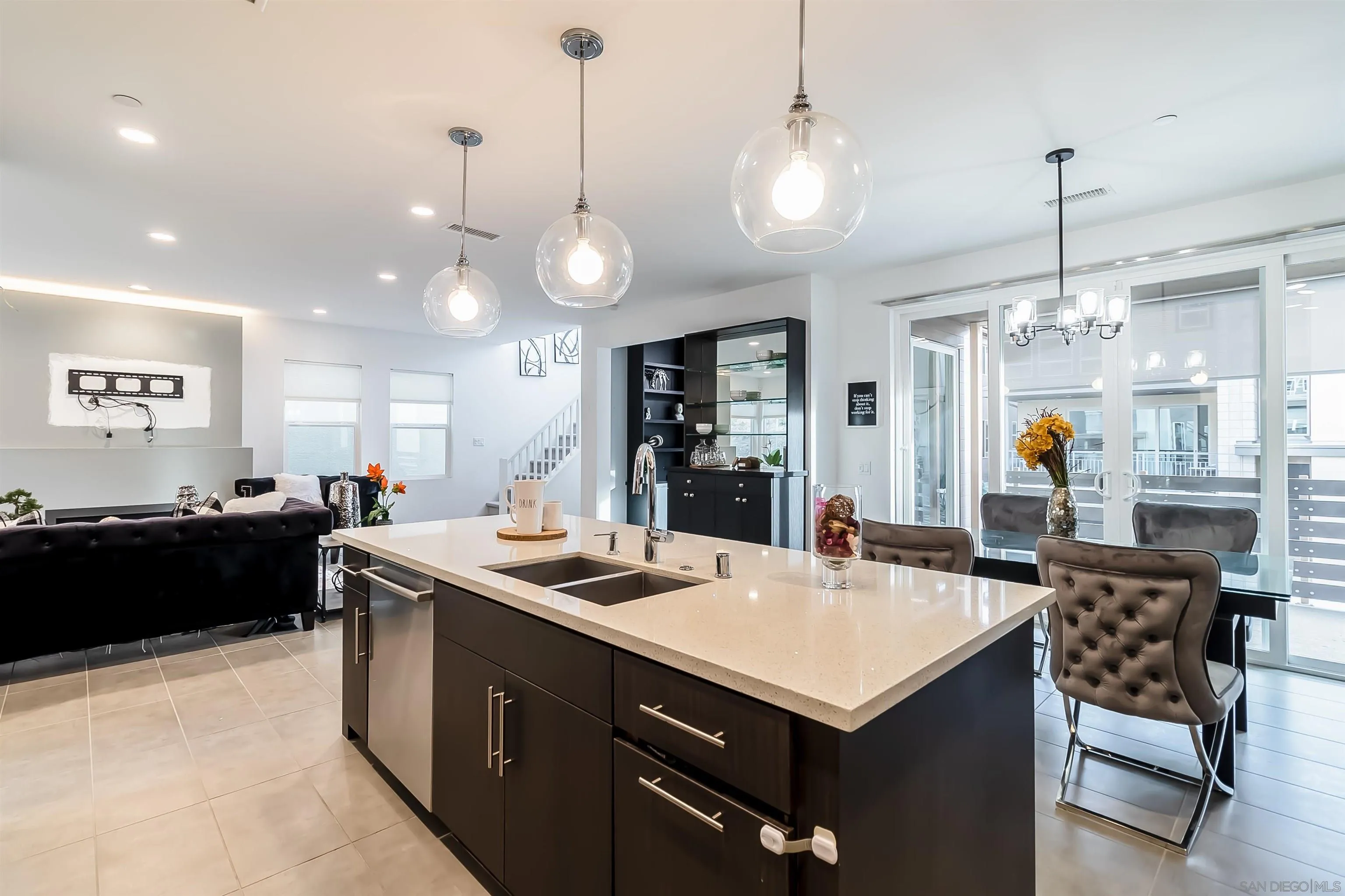 8344 Summit Way San Diego, CA 92108 - Photo 8 of 41 a kitchen with a stove a refrigerator a sink dishwasher with a dining table and chairs