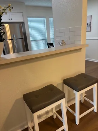 a kitchen with a table and a stove