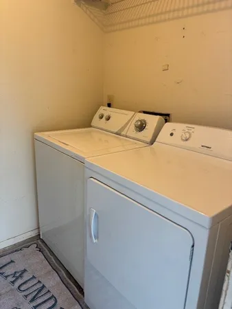 a utility room with dryer and washer