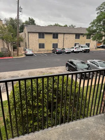 a couple of cars parked in front of a house