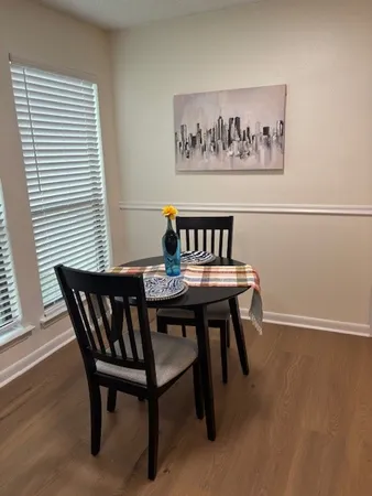 a view of a chairs and table in a room
