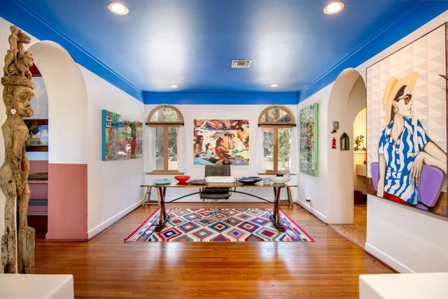 a kitchen with stainless steel appliances kitchen island granite countertop a sink and cabinets