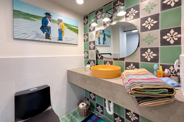 a view of swimming pool with a garden and plants